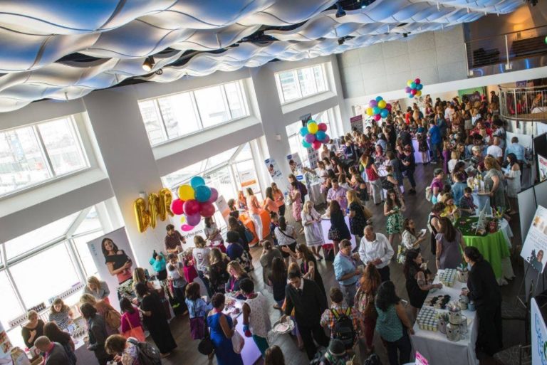 Guests enjoying cocktail hour and vendors around the room