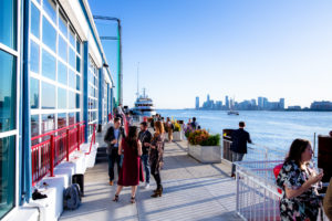 Guest enjoying the veranda by the Hudson River on a sunny day
