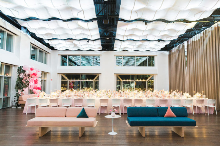 Long dinner tables at pastel pink and blue themed Mitzvah reception