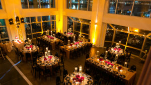 Current Mitzvah in a gold theme picture of tables from above