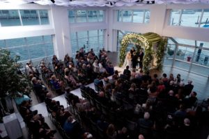 Ceremony capture from above, guests are seated and couple up front