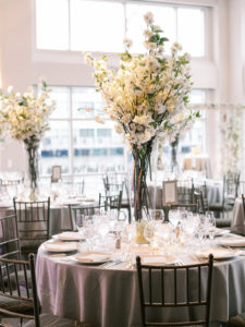 Three Dinner tables set for dinner, with daylight at Current