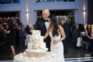 Current bride and groom cutting the cake