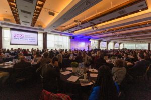 presenter on stage at a meeting at Pier Sixty
