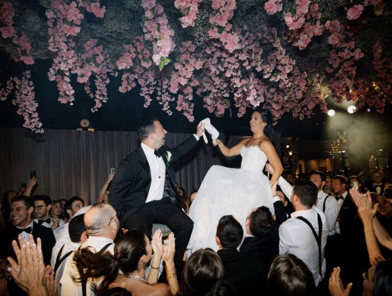 The Lighthouse, Pier 61 Wedding reception bride and groom lifted on chairs
