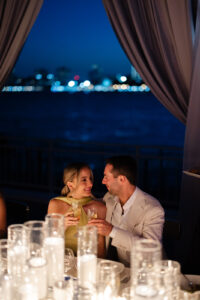 Bride-and-Groom-dining-at-their-rehearsal-dinner-over-the-stars-at-Pier-Sixty