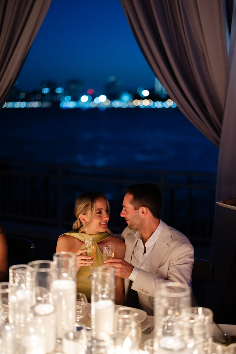 Bride-and-Groom-dining-at-their-rehearsal-dinner-over-the-stars-at-Pier-Sixty