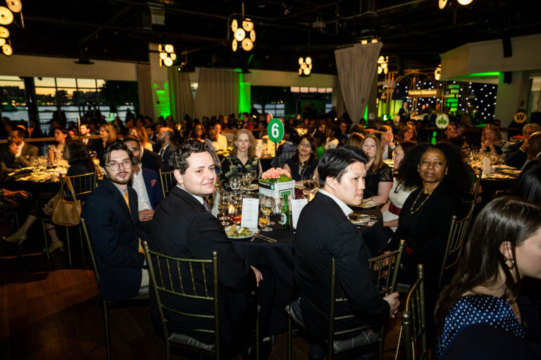 Speaker on Stage while guests dining for the Big Brothers Big Sisters Gala at The Ligthouse