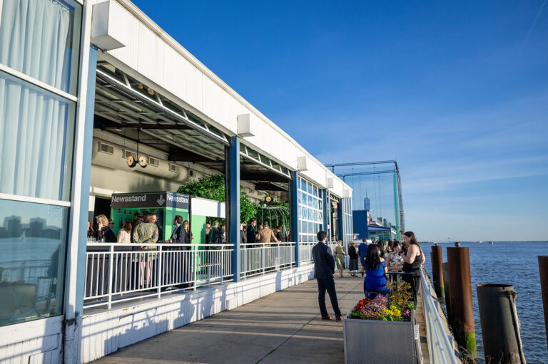 Guests enjoying the cocktail hour in the outdoor veranda for Big Brothers Big Sisters Gala at The Ligthouse