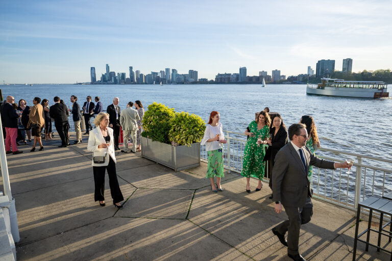 Guests enjoying the cocktail hour in the outdoor veranda for Big Brothers Big Sisters Gala at The Ligthouse