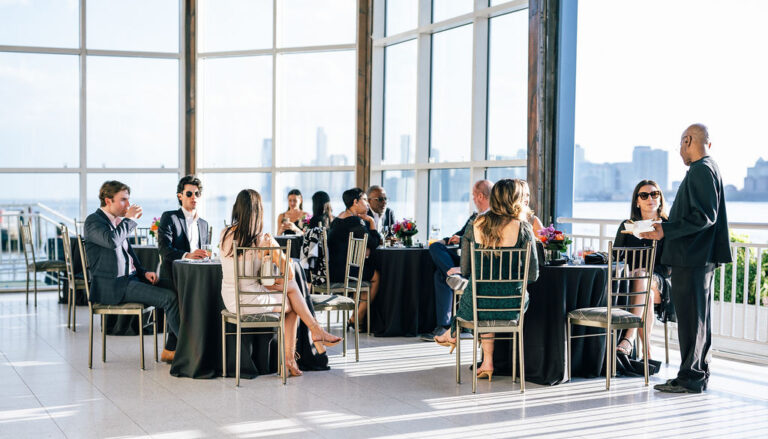 Guests seated at the All-Season Terrace that opens onto the the Hudson River for the perfect outdoor space at Kulture City Gala at The Lighthouse