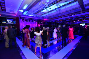 Guests on a Black and White Striped dance floor Mount Sinai Crystal Party at Pier Sixty
