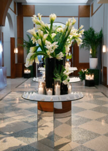 escort card table with flowers and candles