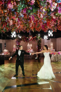The Lighthouse, Pier 61 Wedding Reception Couple Dancing under Floral Installation