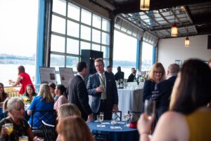 Guests sitting and grabbing drinks after a meeting on The Lighthouse All Season Terrace